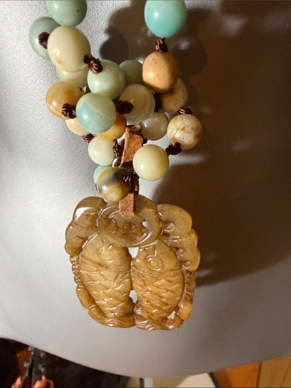 Jadeite Fish Pendant on a 23” drop hand knotted bead necklace